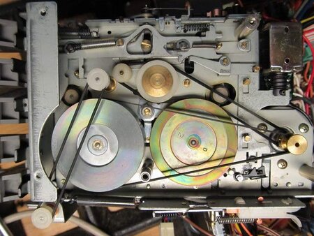 Under side of tape deck showing belts.jpg